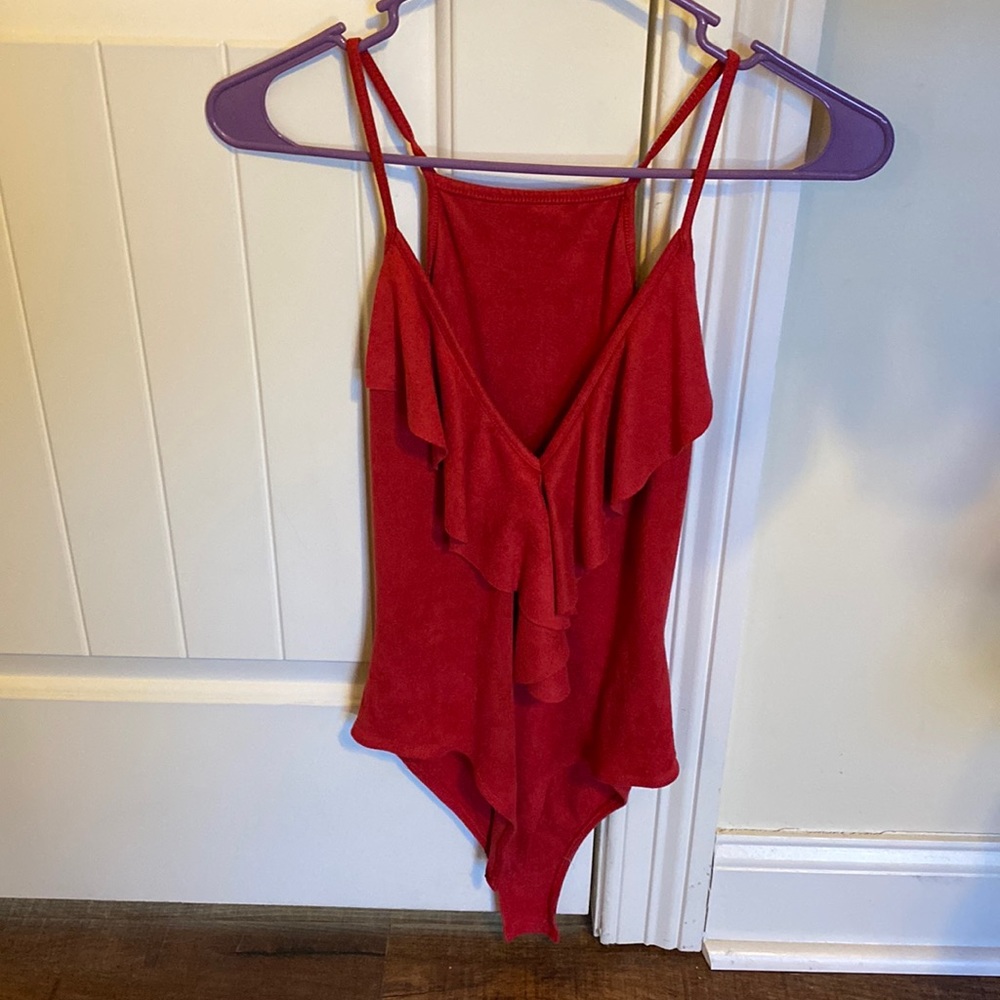 Looove this super cute and stylish suede, ruffled body suit!